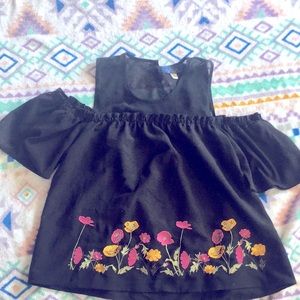 A cold shoulder shirt with flowers
